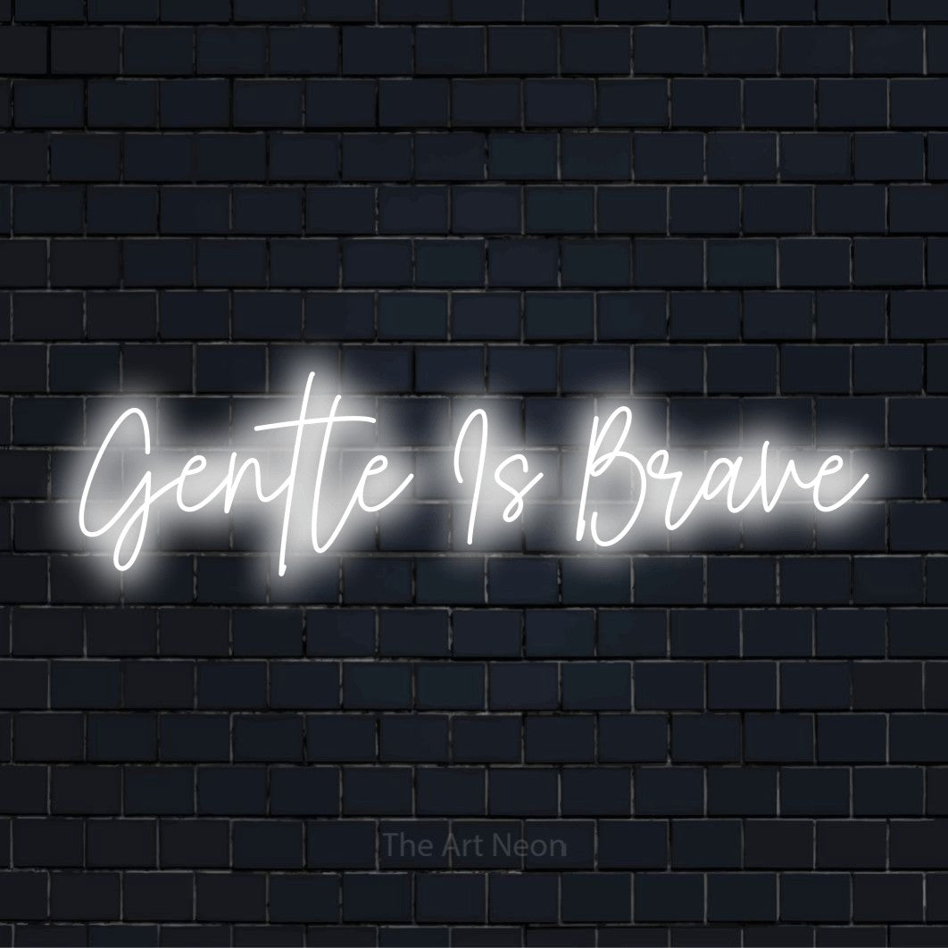 "Gentle Is Brave" LED neon sign on a black brick wall