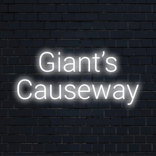 Giant S Causeway Neon Sign, glowing wall decor on dark brick wall
