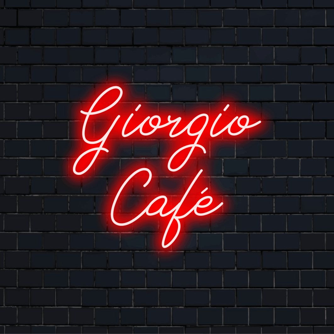 Giorgio Cafe Personalized Neon Light with neon text light against brick backdrop