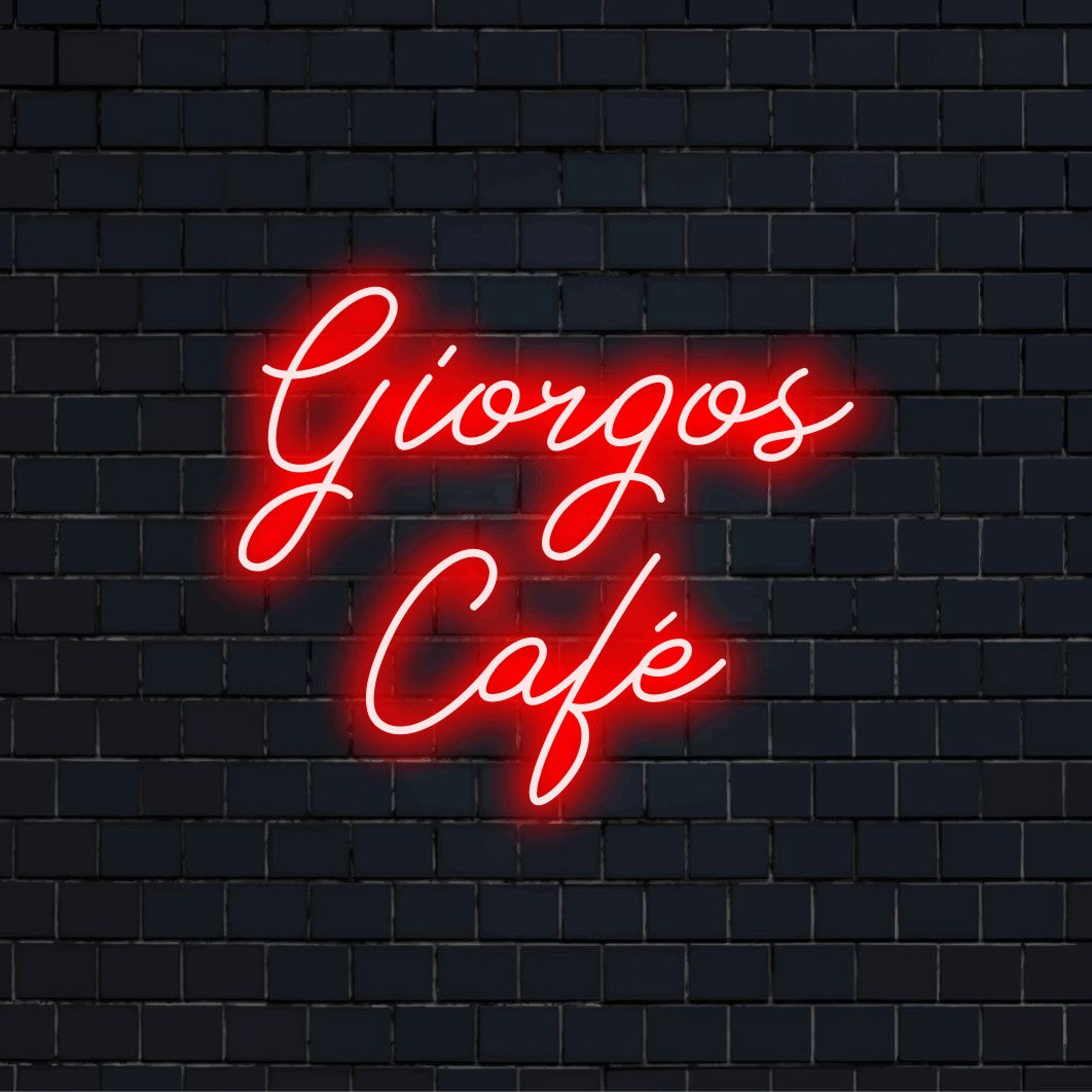 Giorgos Cafe Custom Name Neon Sign, glowing neon text against black brick wall