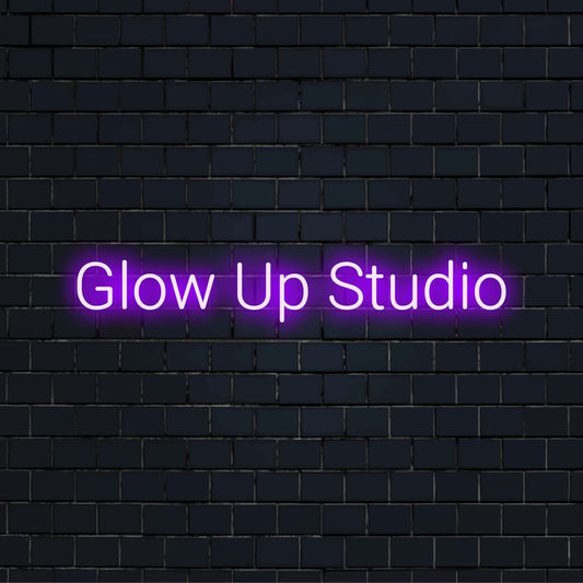 Glow Up Studio LED Neon Sign, bright LED glow on black brick background
