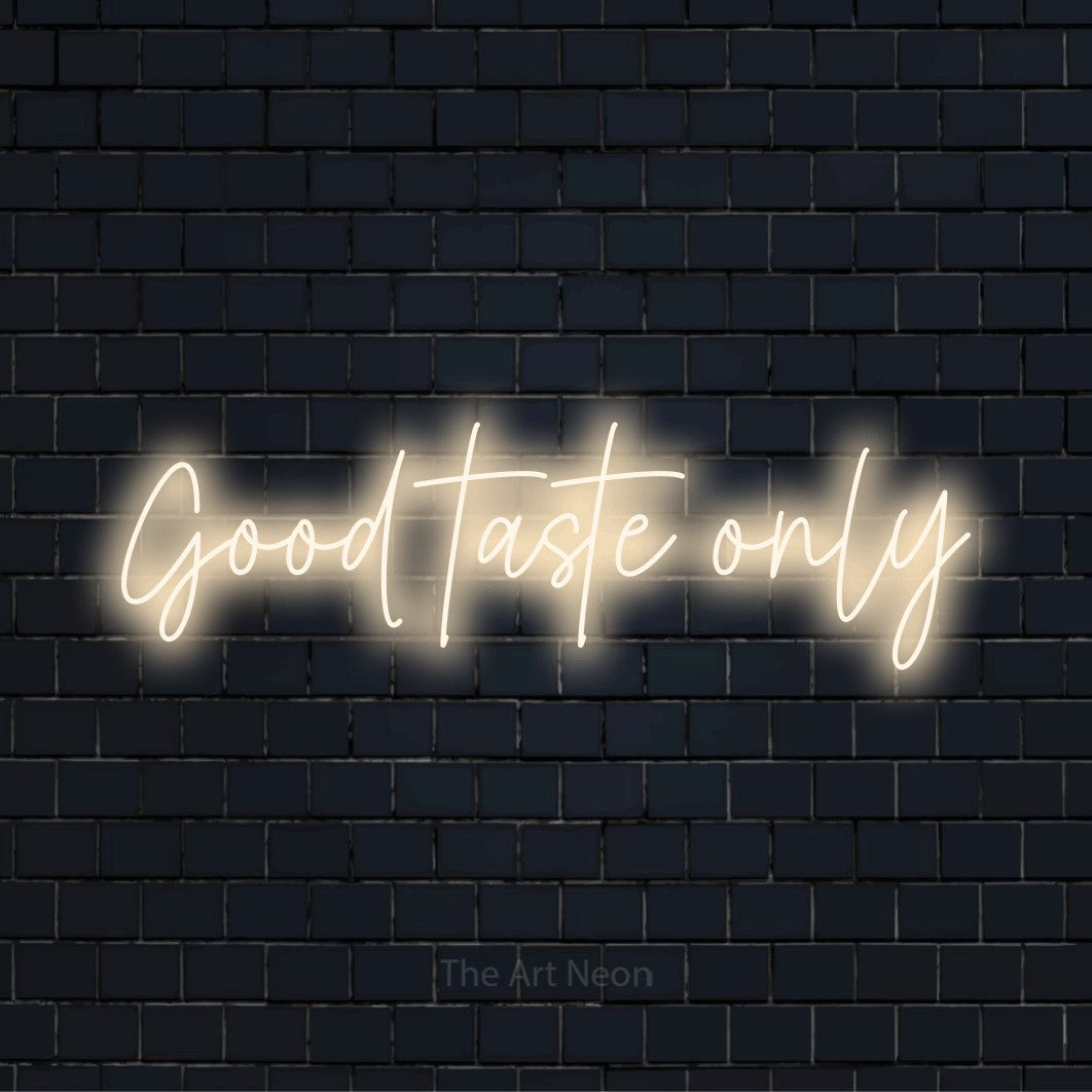"Good Taste Only" neon text design on a black brick wall