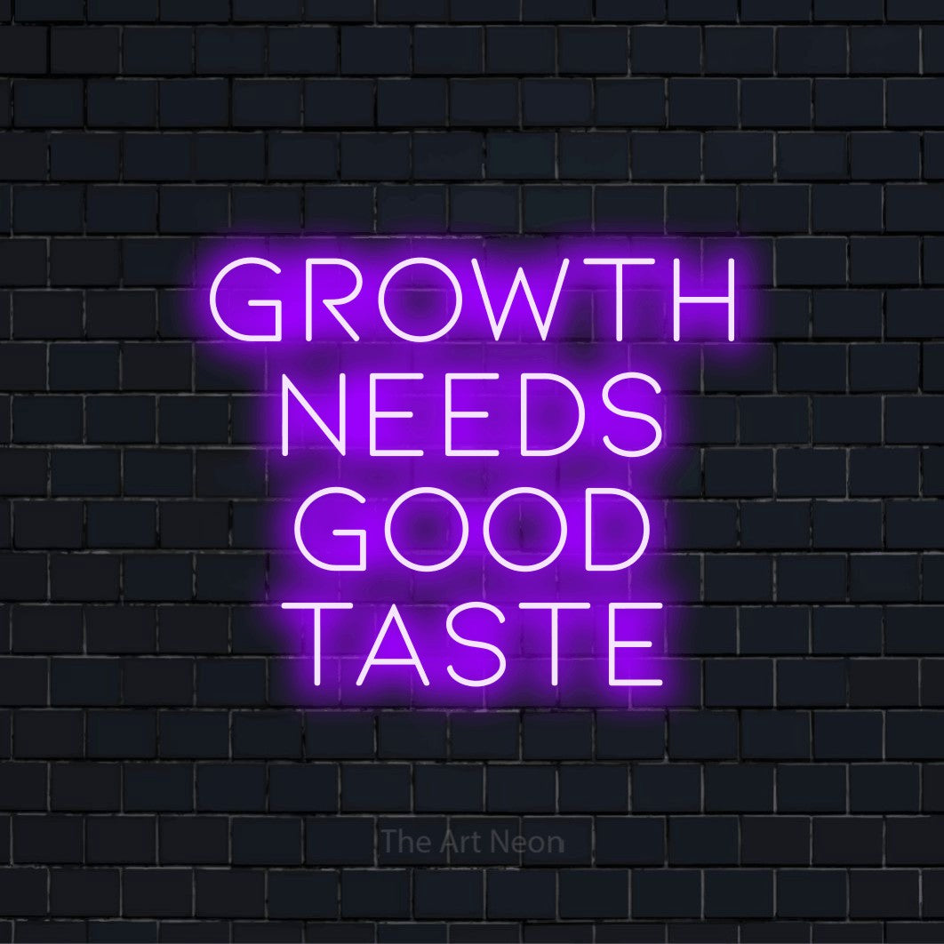 "Growth Needs Good Taste" neon text design on a black brick wall