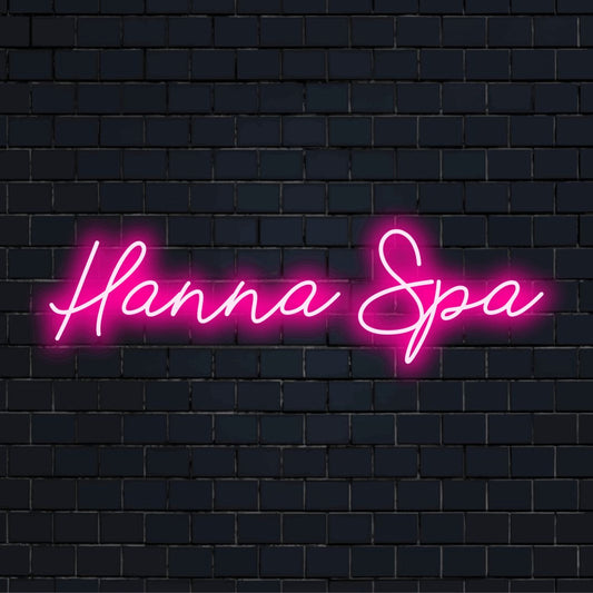 Hanna Spa Personalized Neon Light with bright neon lettering against black brick wall