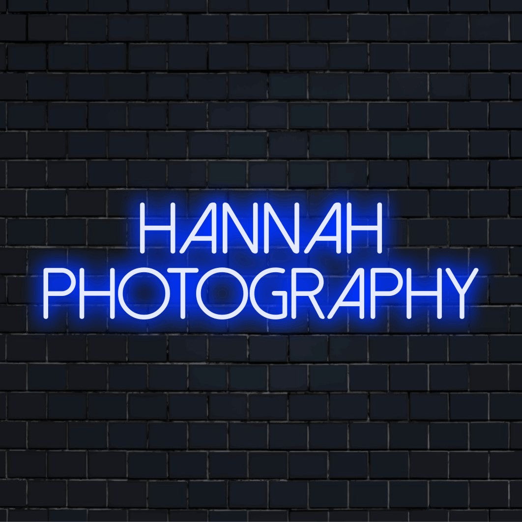 Hannah Photography Custom Name Neon Sign, bright LED glow against black brick wall