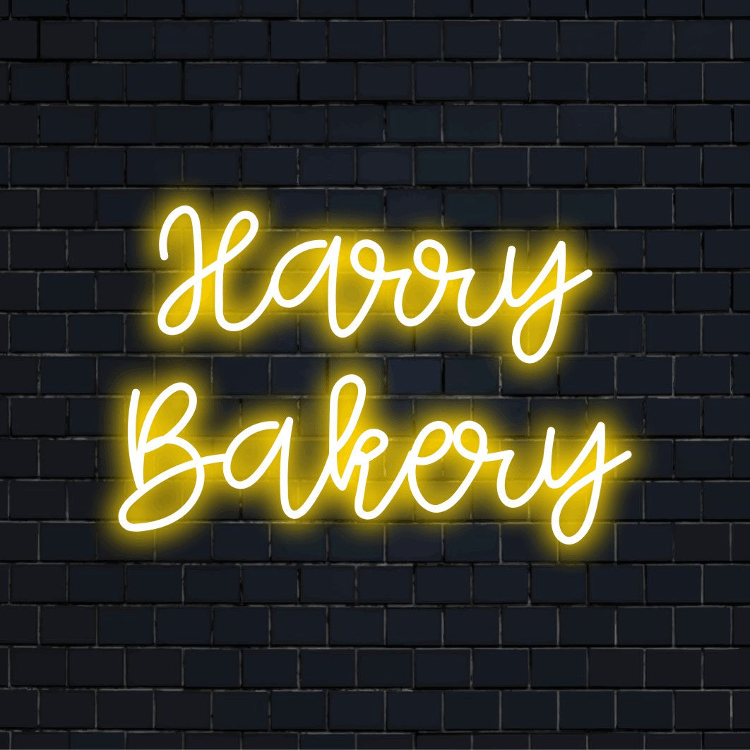 Harry Bakery Personalized Neon Light with bright neon lettering on black brick background