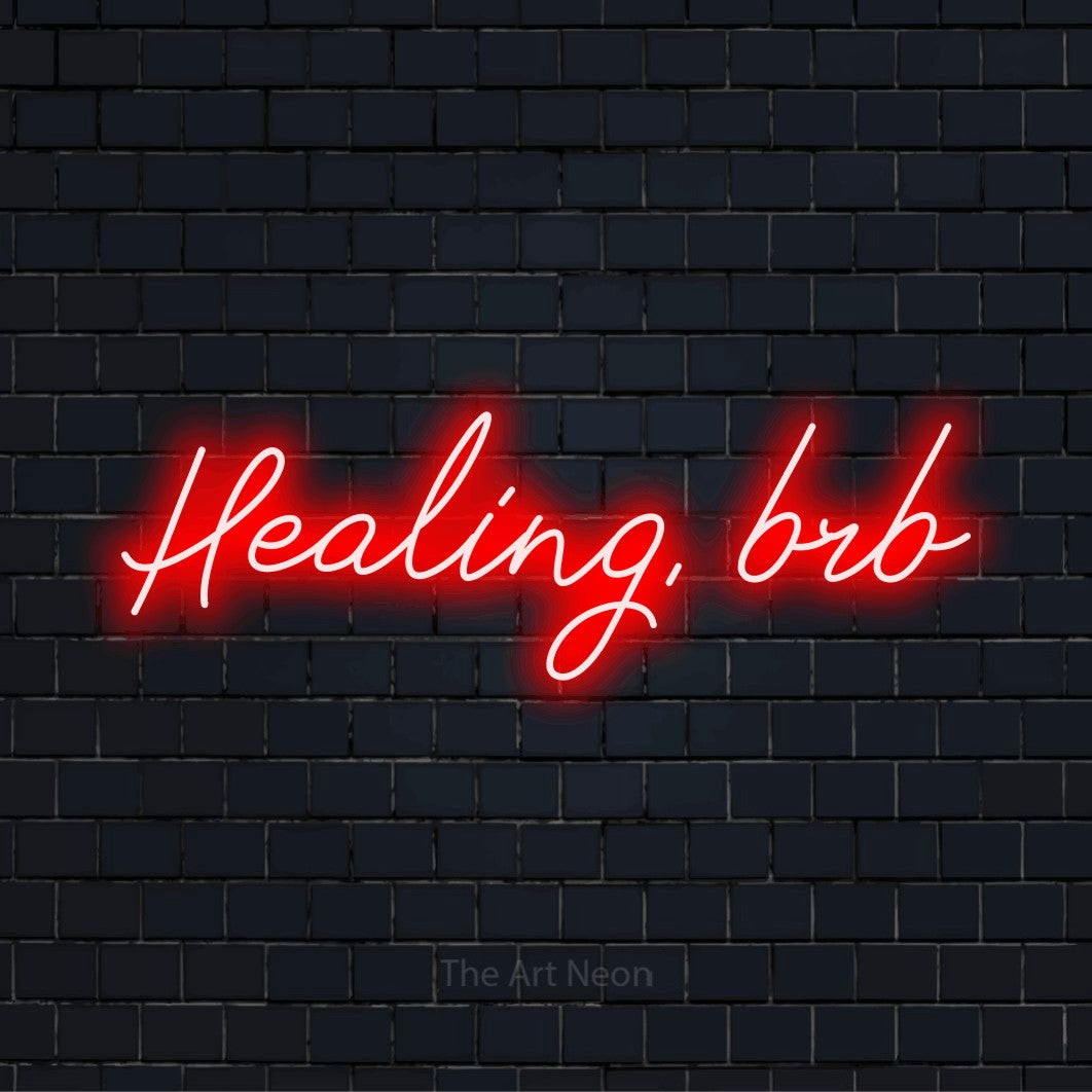 "Healing, Brb" text design with neon effect on a black brick wall