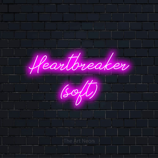 "Heartbreaker (soft)" text design with neon effect on a black brick wall