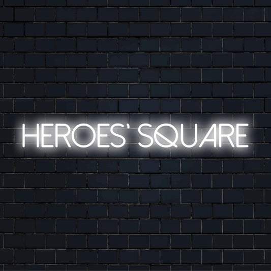 Heroes Square Neon Sign, neon text light on dark brick wall