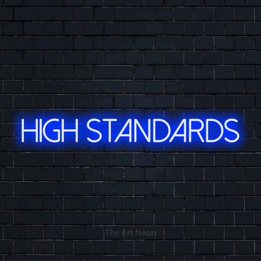 "High Standards" script-style LED neon sign on a black brick wall