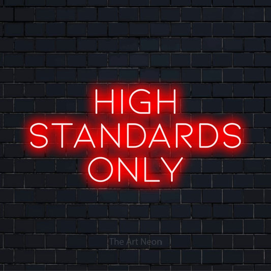 "High Standards Only" LED neon sign on a black brick wall