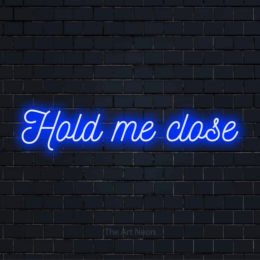 "Hold Me Close" text design with neon effect on a black brick wall