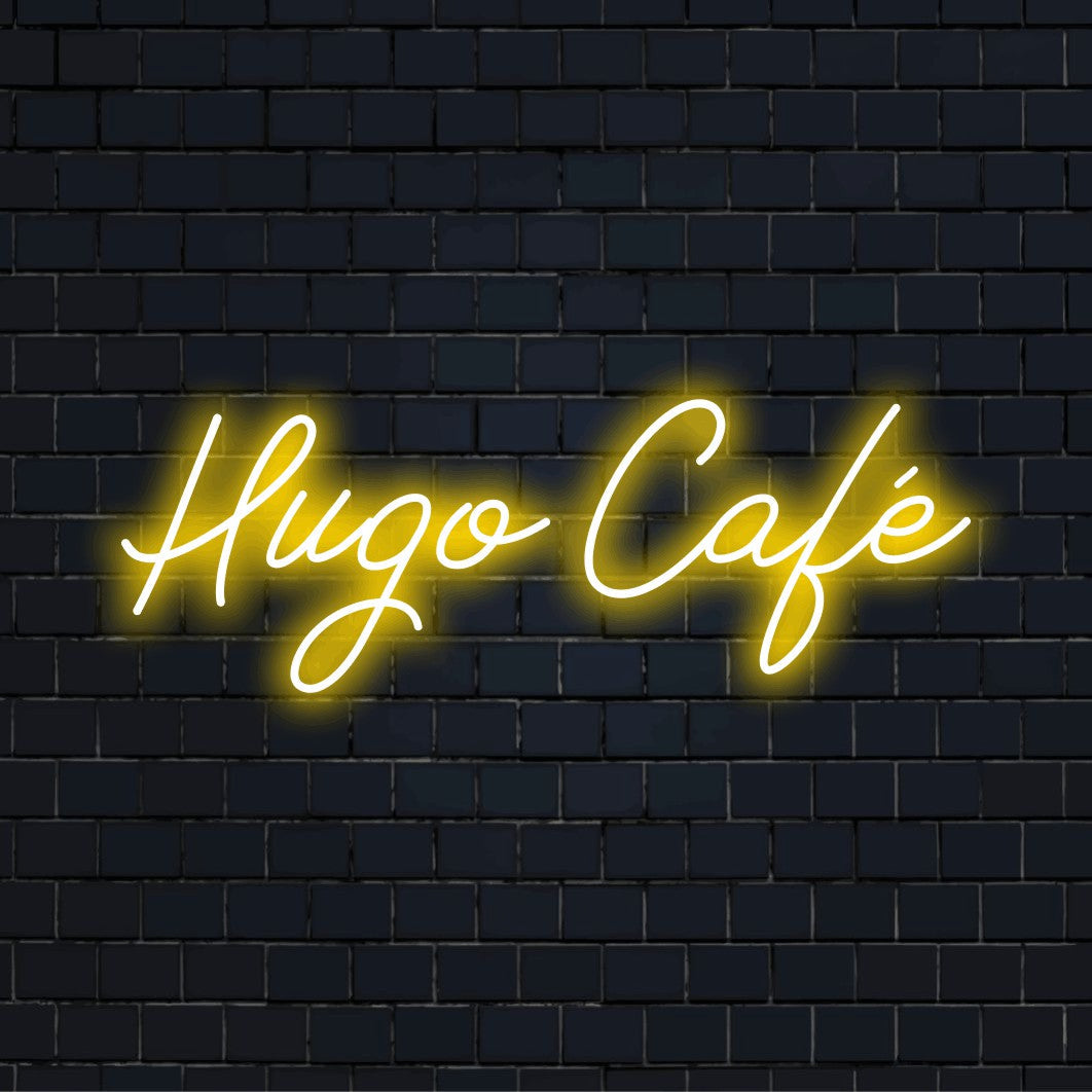Hugo Cafe Personalized Neon Light with glowing lettering against brick backdrop