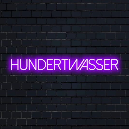 Hundertwasser LED Neon Sign, bright neon lettering on dark brick wall