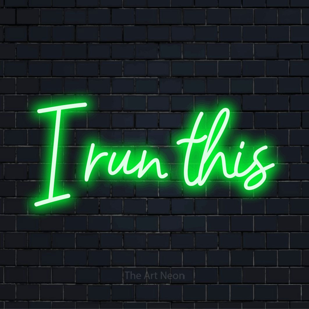 "I Run This" glowing LED neon sign on a black brick wall