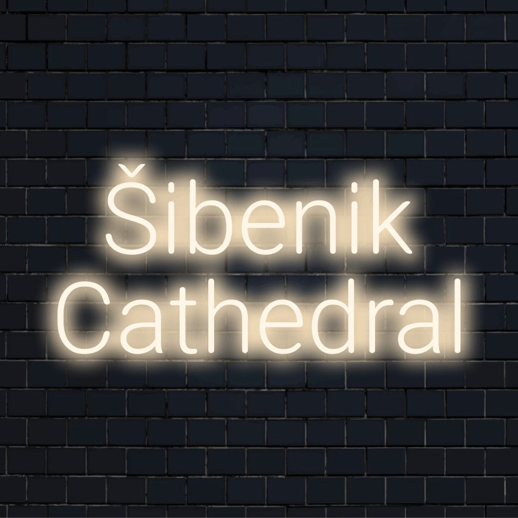 Ibenik Cathedral LED Neon Sign, glowing lettering against black brick wall