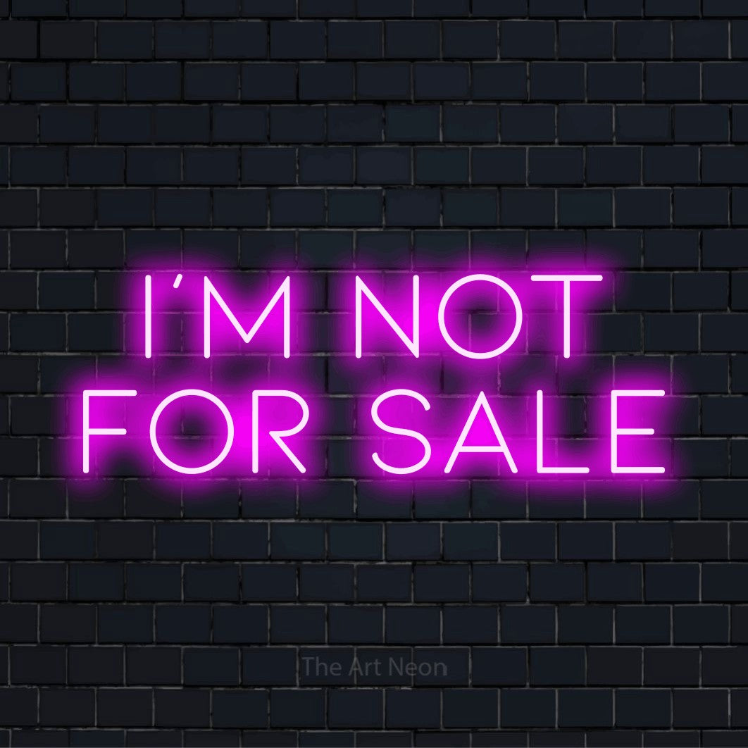 "I’m Not For Sale" neon text design on a black brick wall