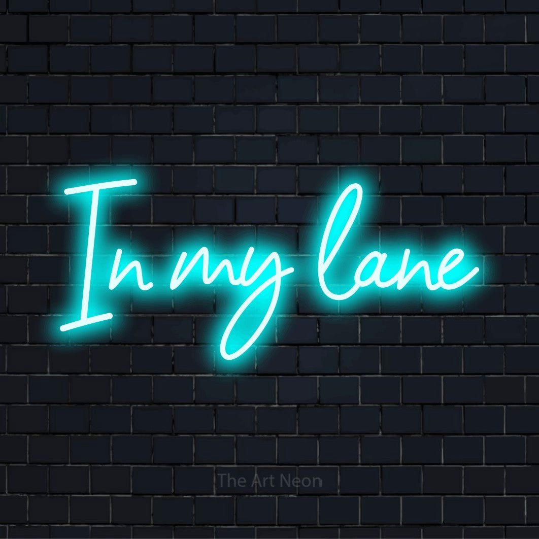 "In My Lane" neon text design on a black brick wall