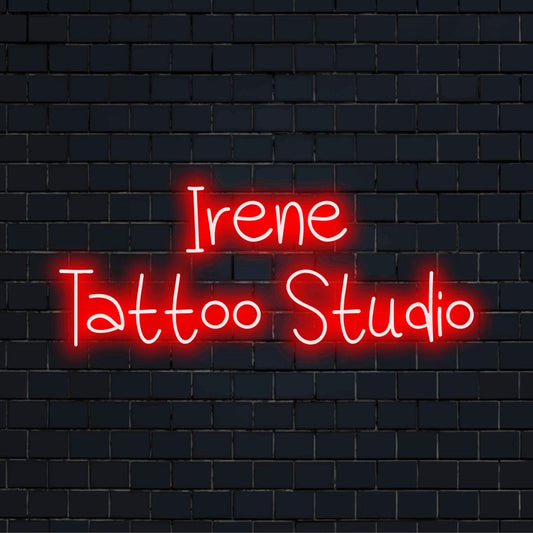 Irene Tattoo Studio Personalized LED Neon Sign, bright LED glow against brick backdrop