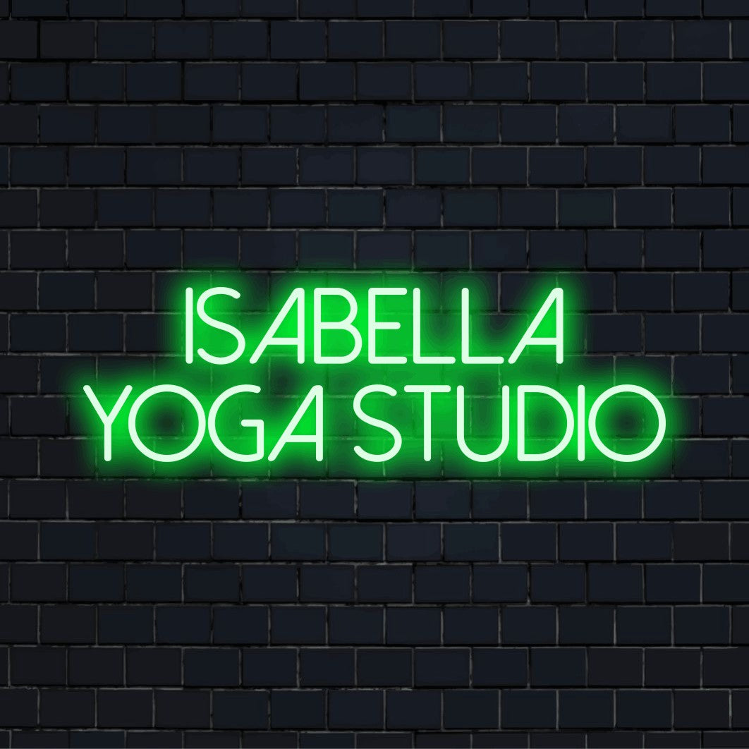 Isabella Yoga Studio Personalized Neon Light with neon text light on black brick background