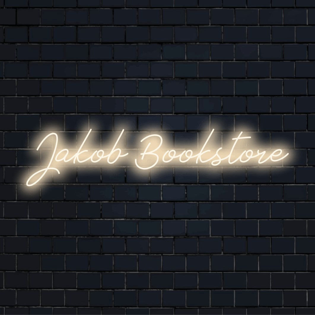 Jakob Bookstore Personalized Neon Light with glowing neon text on dark brick background