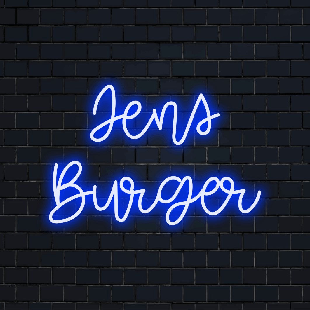Jens Burger Personalized LED Neon Sign, glowing lettering on dark brick background
