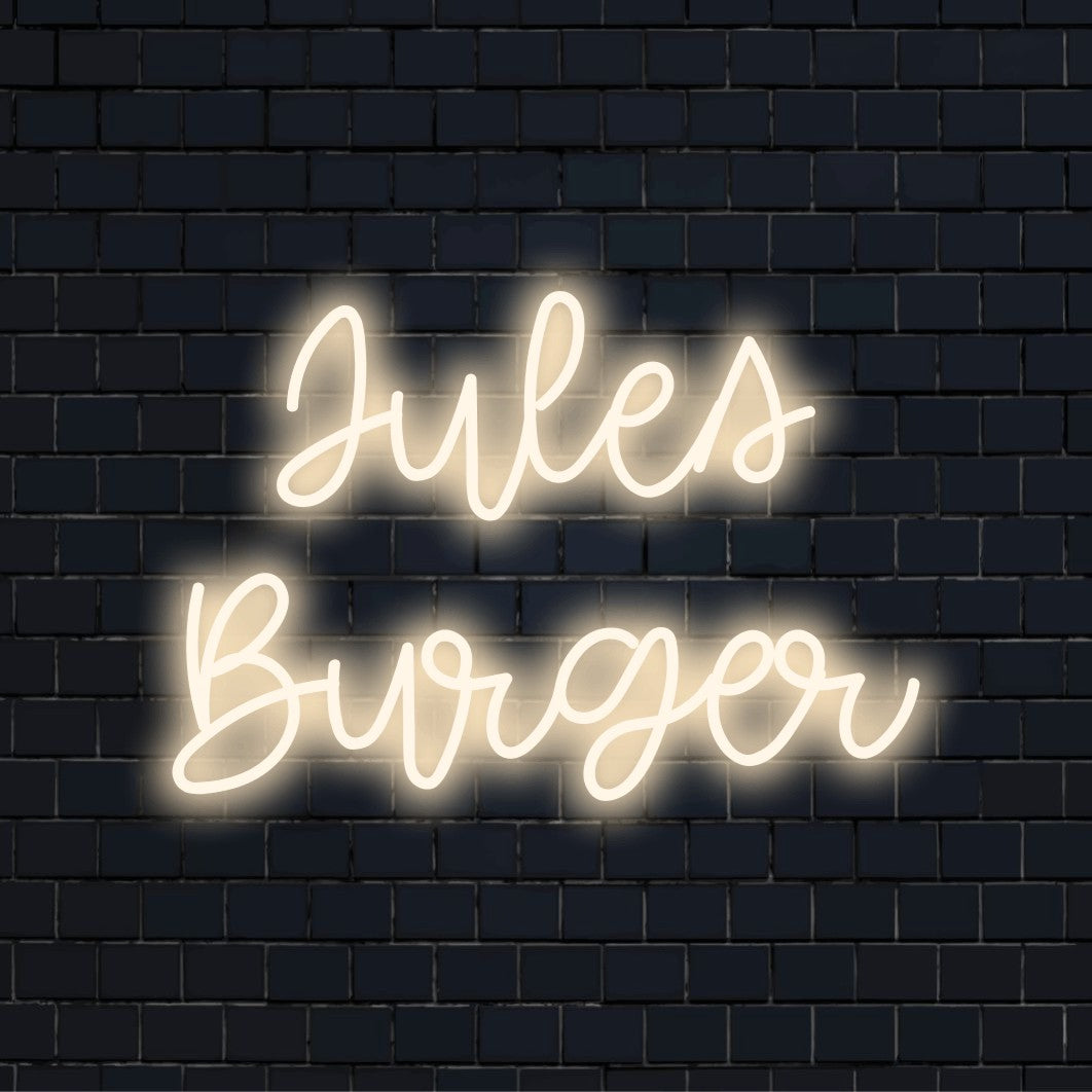 Jules Burger Custom Name Neon Sign, glowing wall decor against brick backdrop