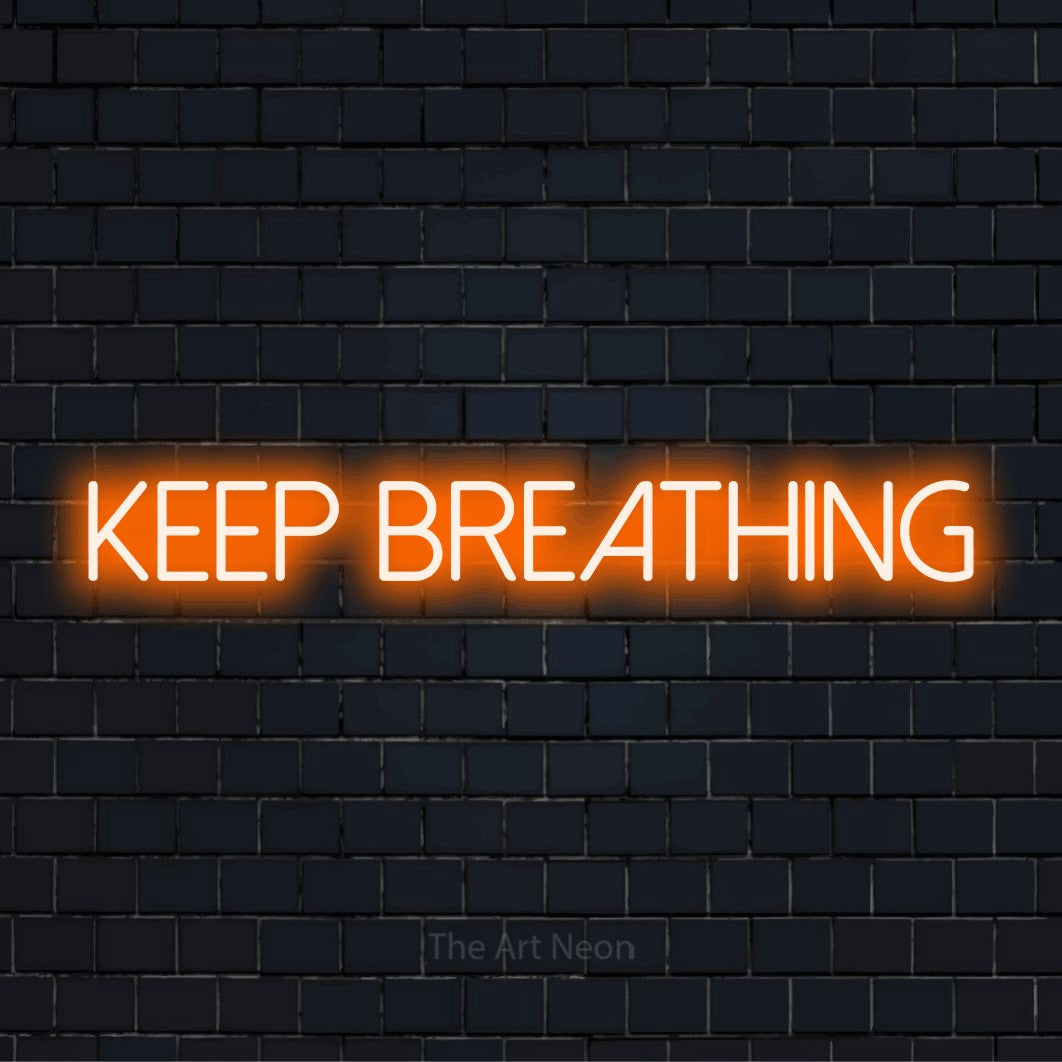 "Keep Breathing" text design with neon effect on a black brick wall