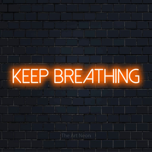 "Keep Breathing" text design with neon effect on a black brick wall