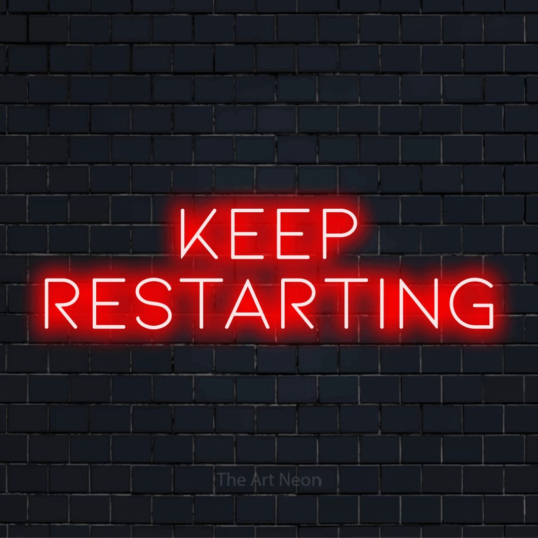 "Keep Restarting" neon text design on a black brick wall