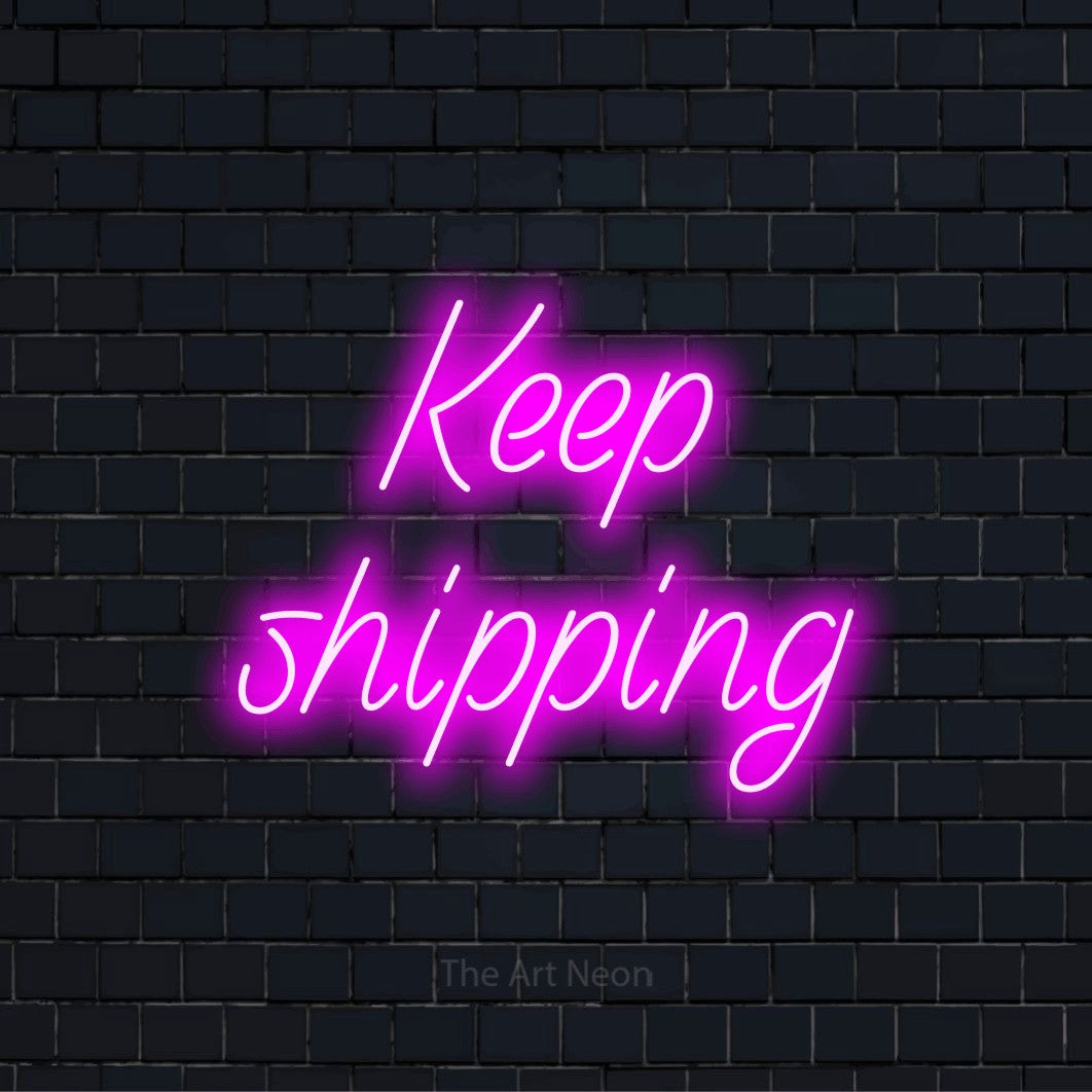 "Keep Shipping" LED neon sign on a black brick wall