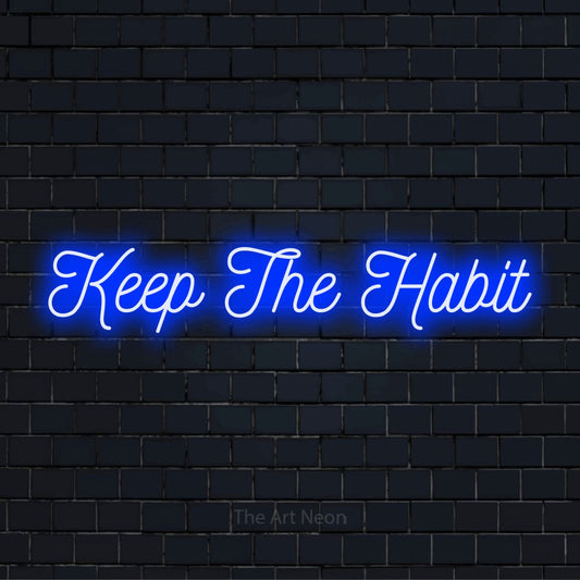 "Keep The Habit" text design with neon effect on a black brick wall
