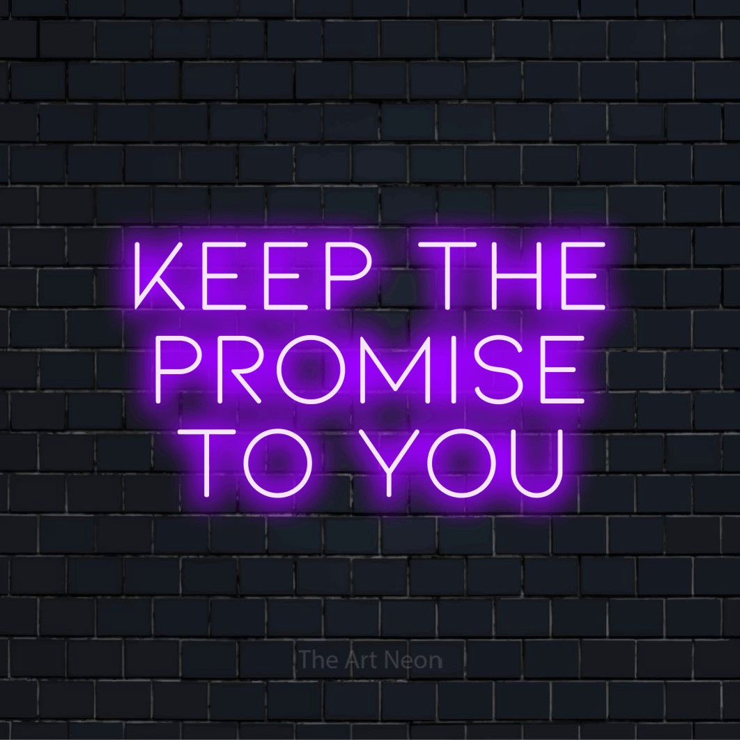 "Keep The Promise To You" LED neon sign on a black brick wall
