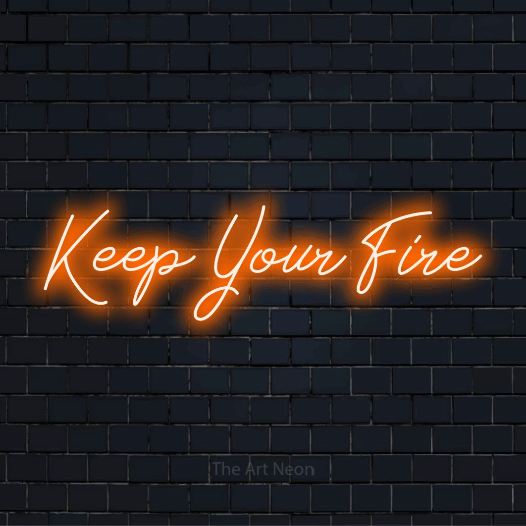 "Keep Your Fire" neon text design on a black brick wall
