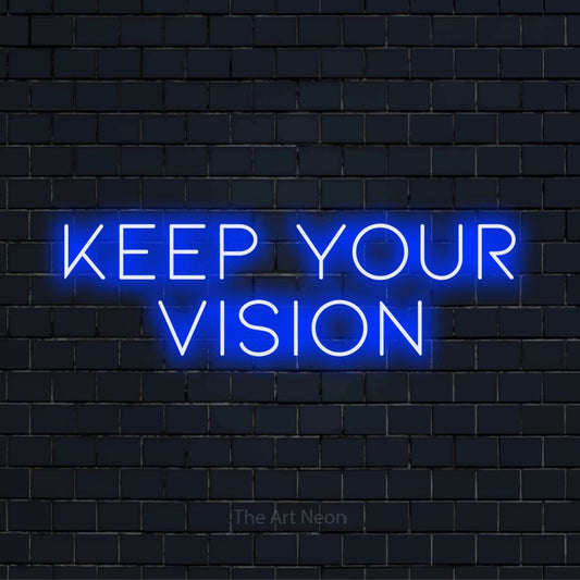 "Keep Your Vision" LED neon sign on a black brick wall