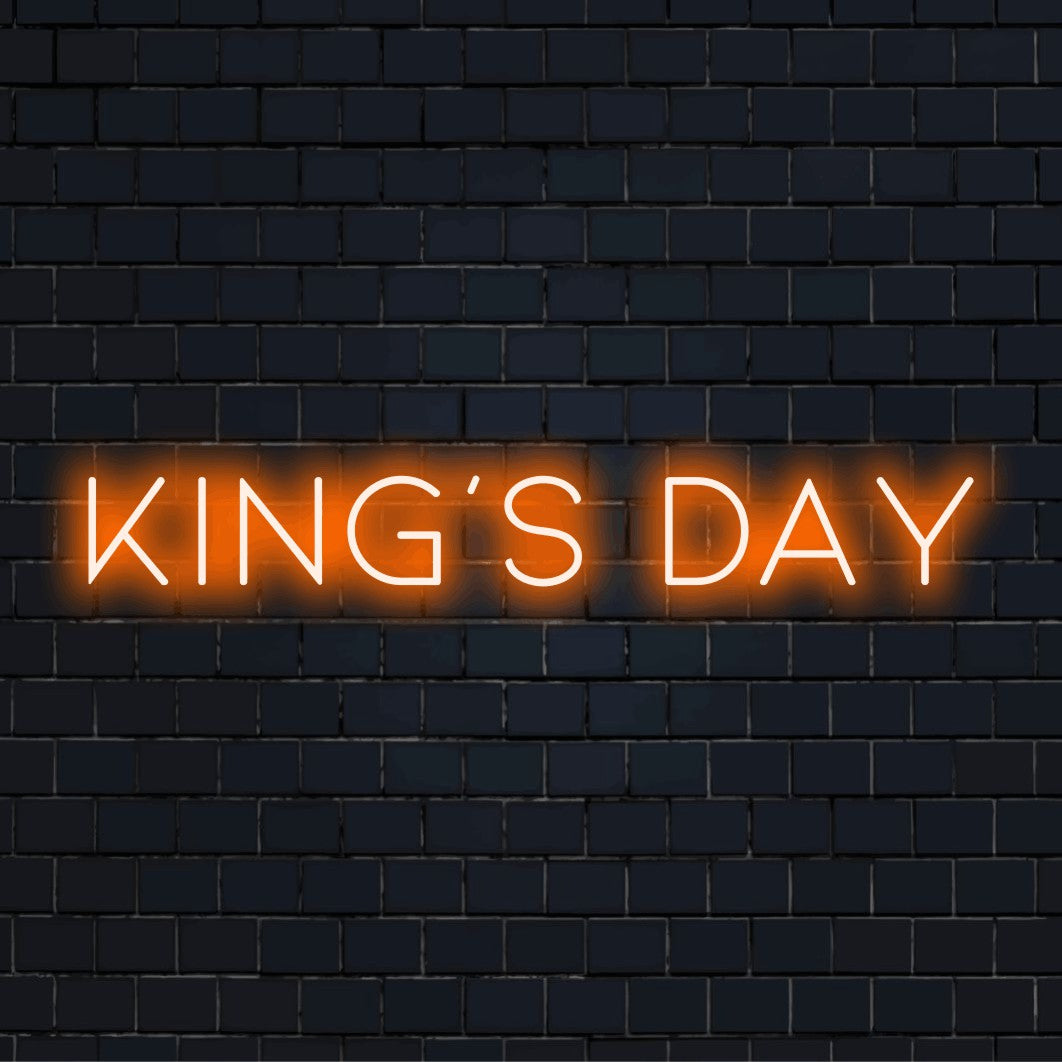 King S Day Neon Sign, bright neon lettering on black brick background