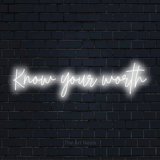 "Know Your Worth" LED neon sign on a black brick wall