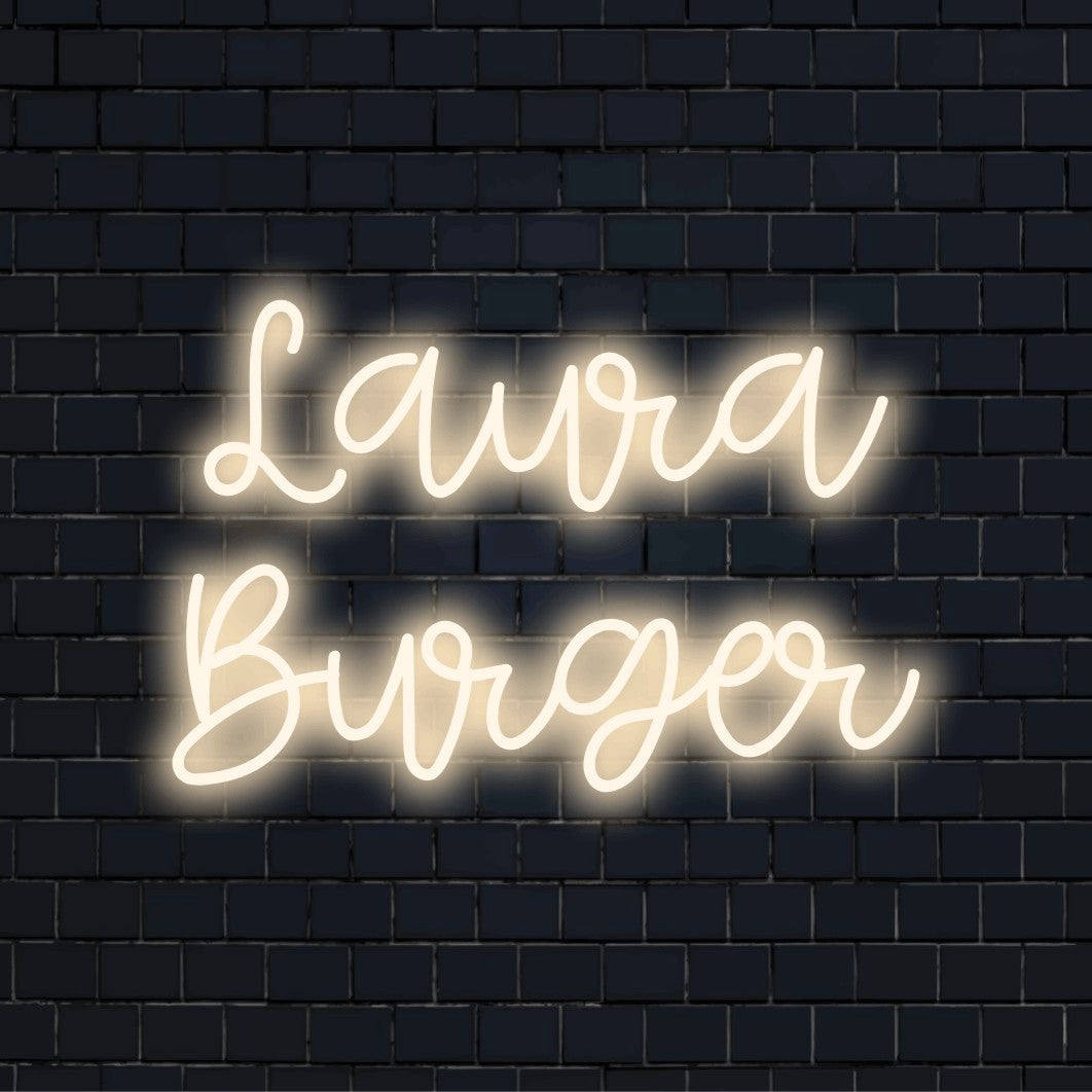 Laura Burger Personalized LED Neon Sign, glowing lettering on dark brick wall