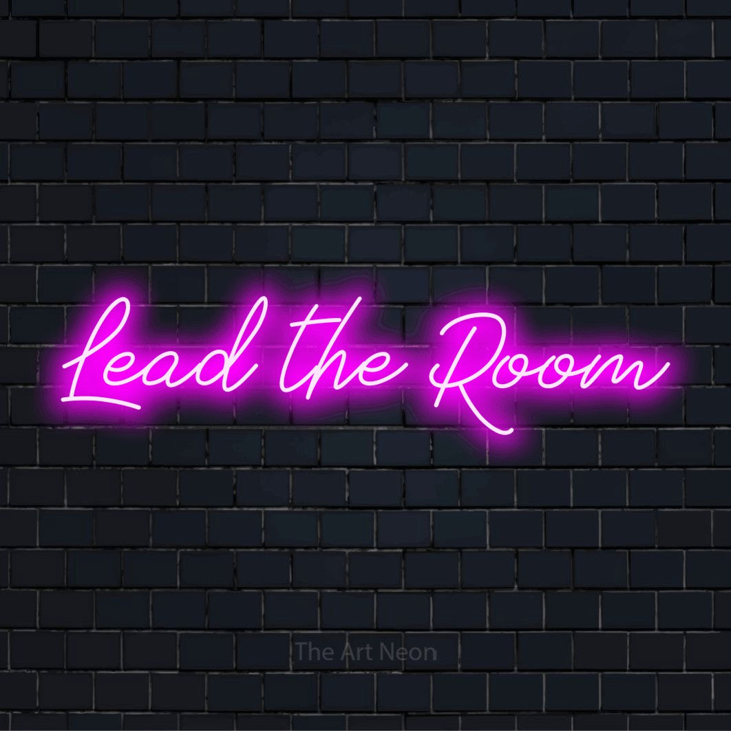 "Lead The Room" glowing LED neon sign on a black brick wall