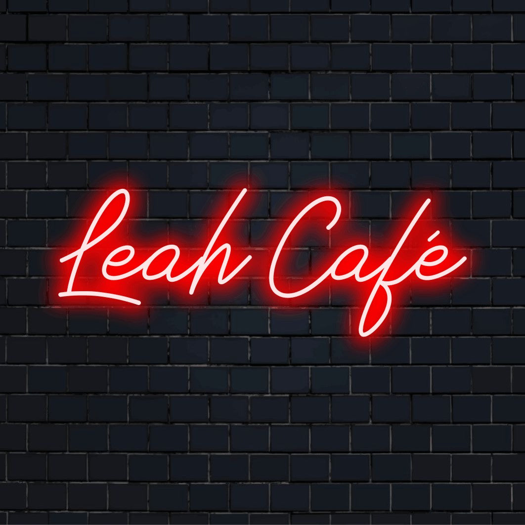 Leah Cafe Custom Name Neon Sign, bright LED glow on dark brick wall
