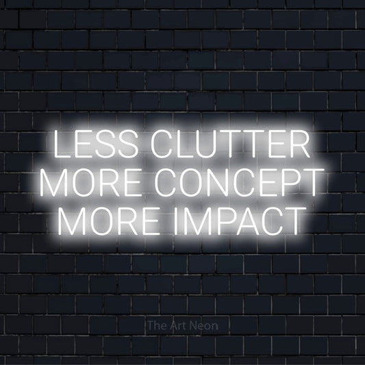 "Less Clutter More Concept More Impact" neon text design on a black brick wall