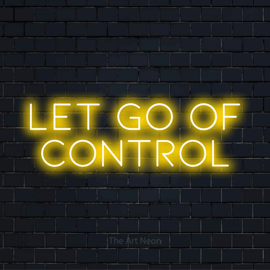"Let Go Of Control" LED neon sign on a black brick wall