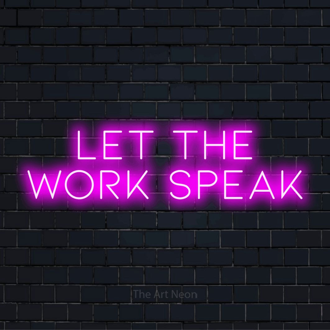 "Let The Work Speak" neon text design on a black brick wall