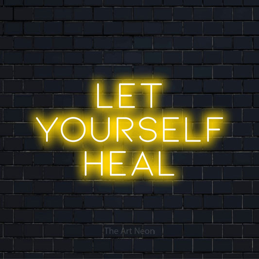 "Let Yourself Heal" text design with neon effect on a black brick wall