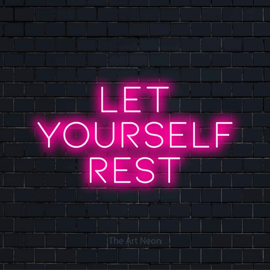 "Let Yourself Rest" glowing LED neon sign on a black brick wall