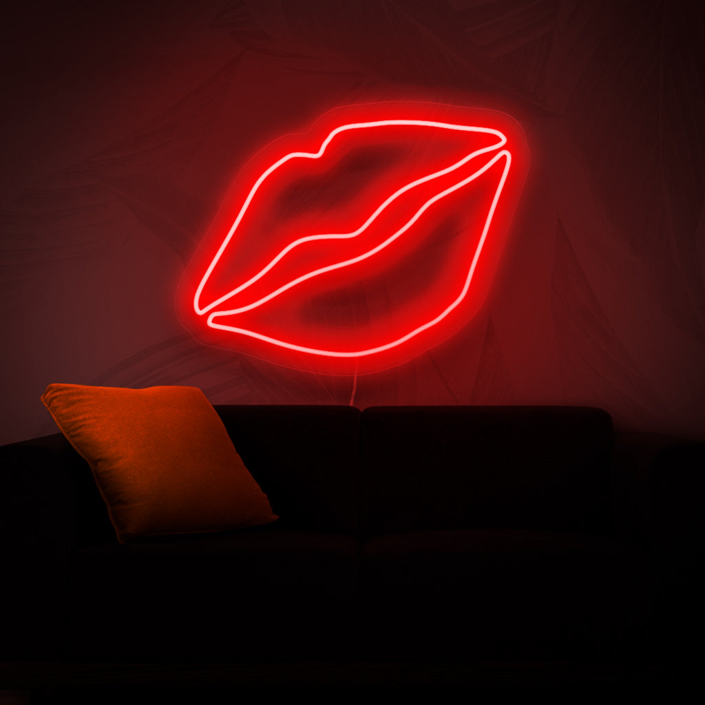 En neonskylt med djärva läppar som ger en touch av skönhet och glamour till alla utrymmen med sitt livfulla och fängslande ljus.