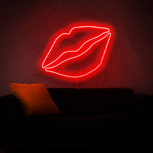 En neonskylt med djärva läppar som ger en touch av skönhet och glamour till alla utrymmen med sitt livfulla och fängslande ljus.