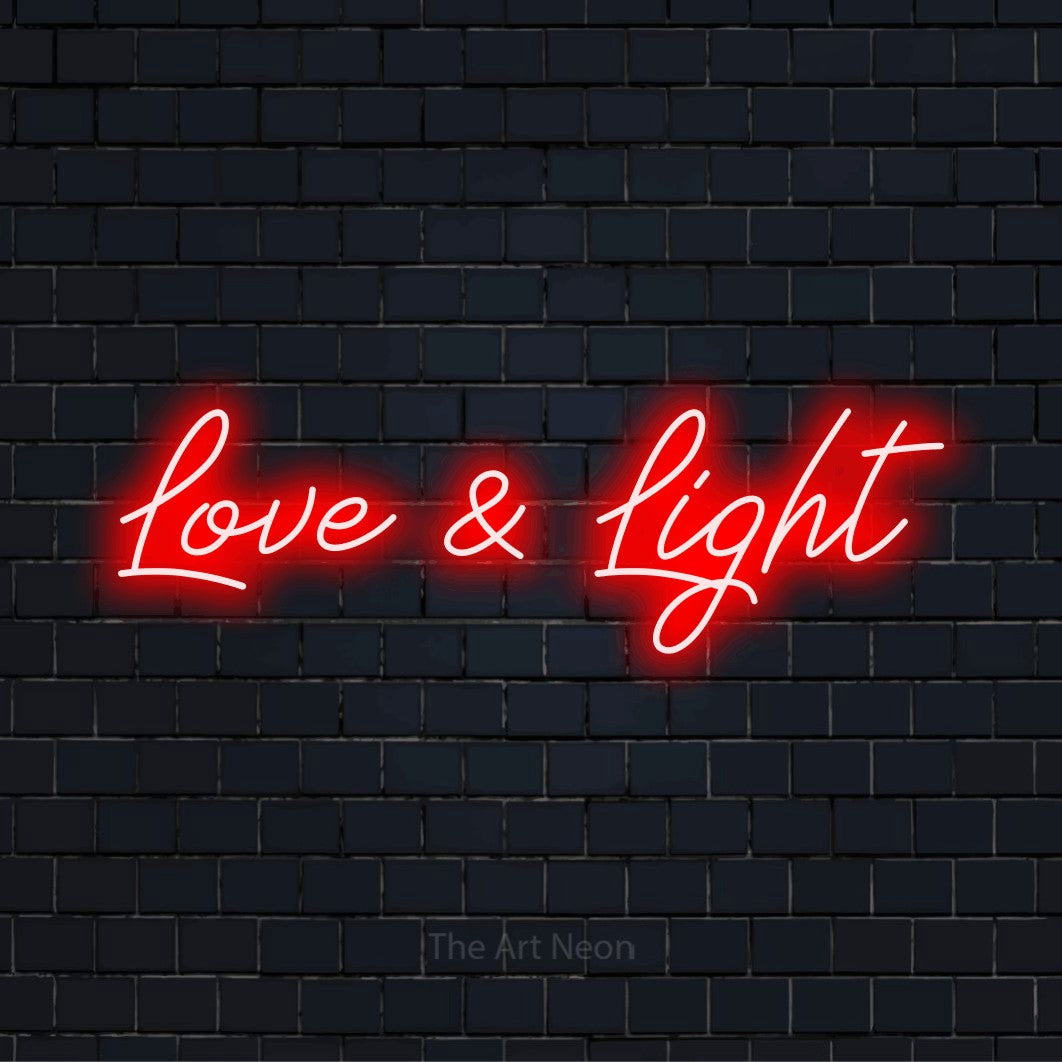 "Love & Light" text design with neon effect on a black brick wall