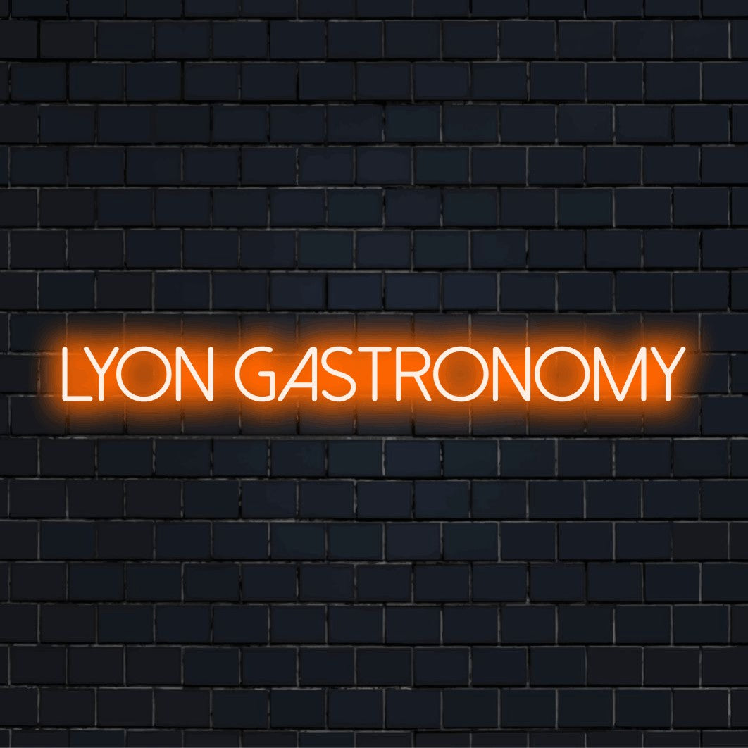 Lyon Gastronomy Neon Light with bright neon glow against brick backdrop