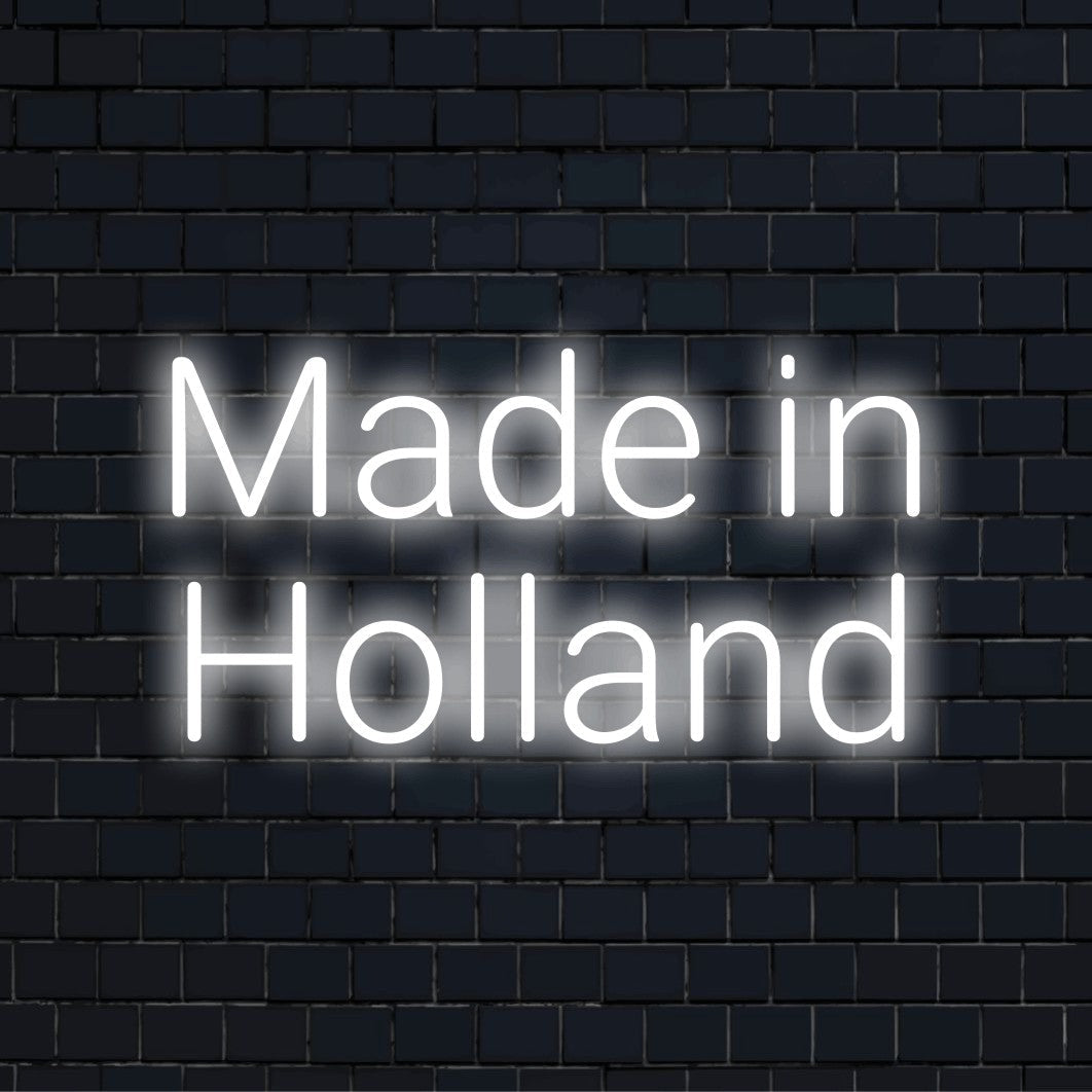 Made In Holland LED Neon Sign, soft neon glow against black brick wall